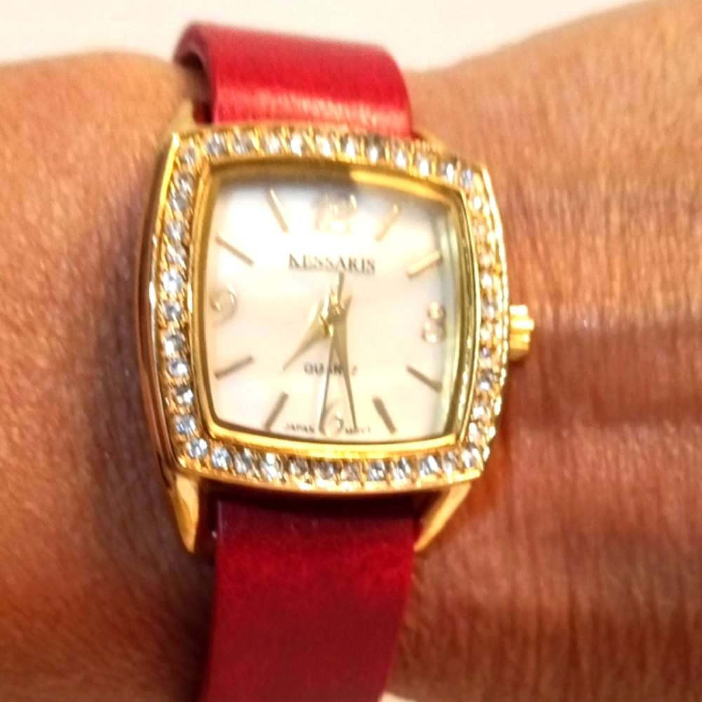 Kessaris Gold Tone and Red Slide Band Watch with Crystal Accents.